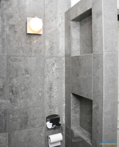 Badrum med stenkänsla och bastu